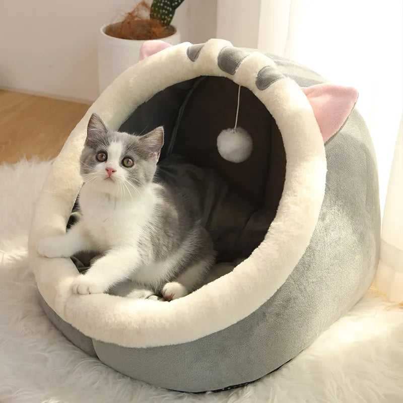 Content pet enjoys Self-Warming Pet Tent Cave Bed. Soft cotton fabric for ultimate comfort. Easy-to-clean design with charming details.